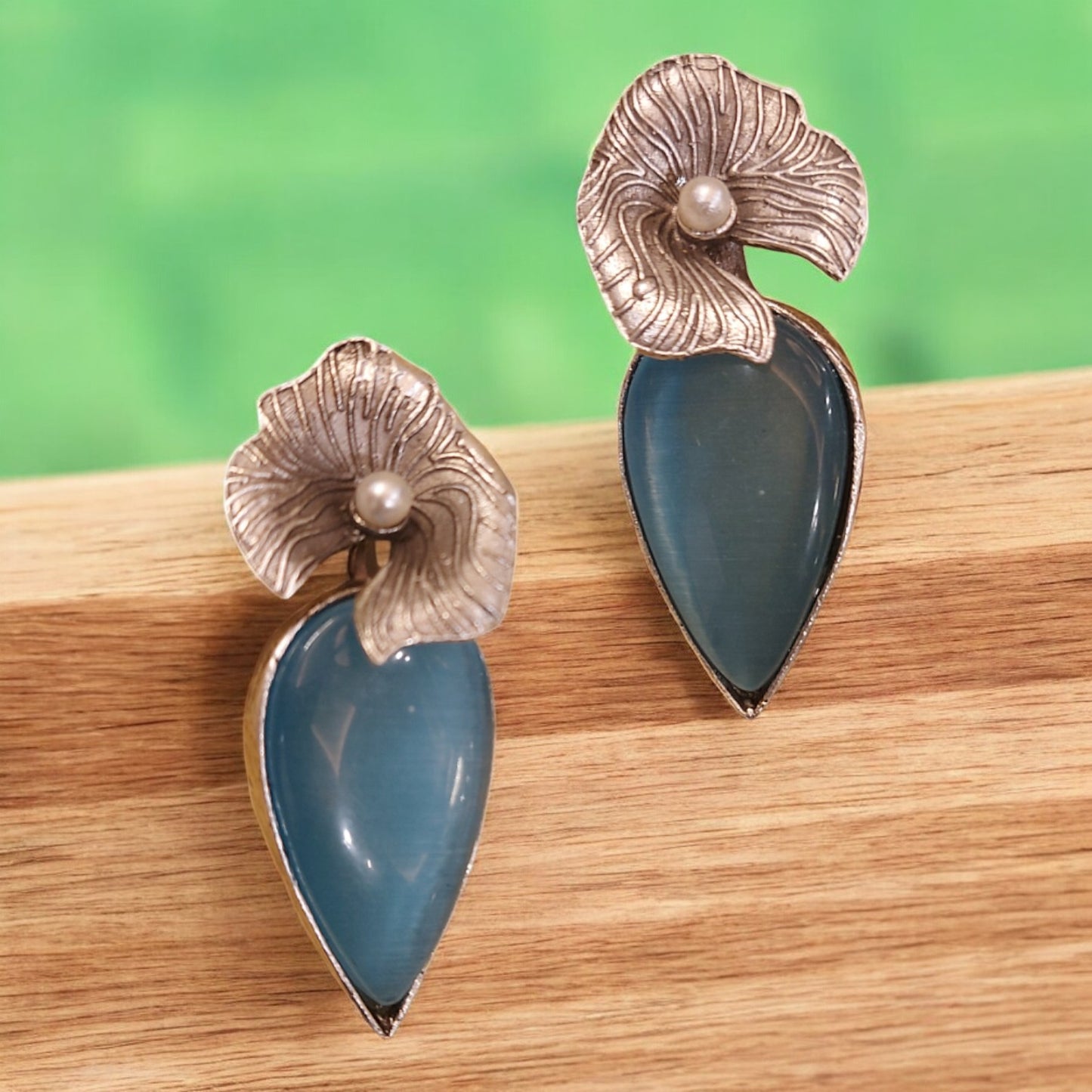 CONTEMPORARY SILVER PETAL AND BLUE STONES FLOWER EARRINGS